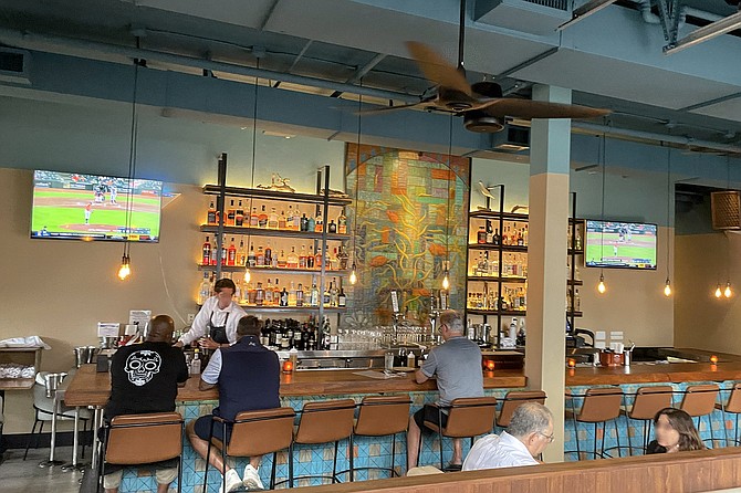 The bar still features artwork from the venue's taco shop days, but no longer the writing on the wall.