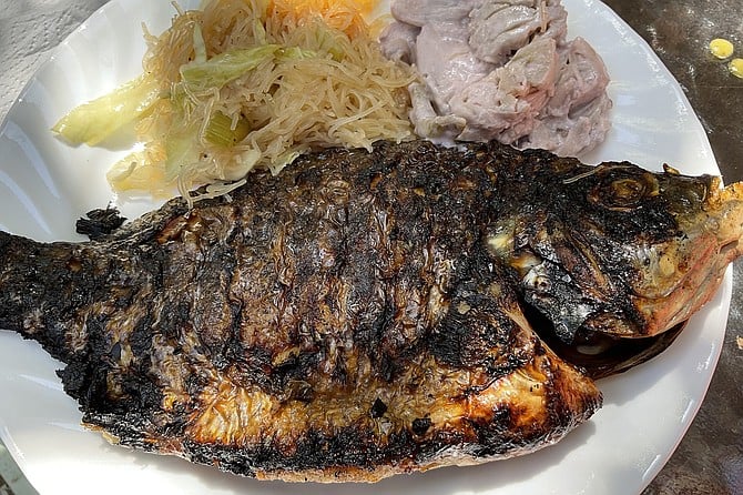 Bangus, the classic grilled Filipino milk fish, with pancit, jackfruit.