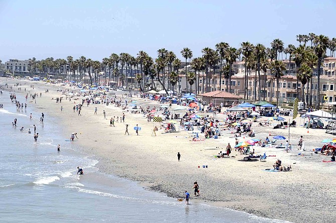 Crowds on the beach in Oceanside, just north of the pier.