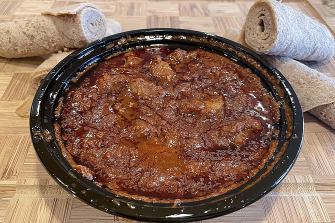 Braise Berber beef, served in a take-out container