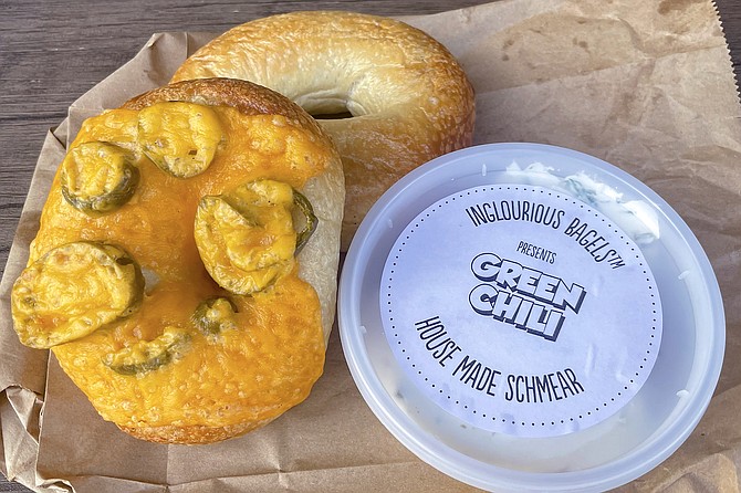 An everything jalapeño bagel, plain bagel, and green chili schmear