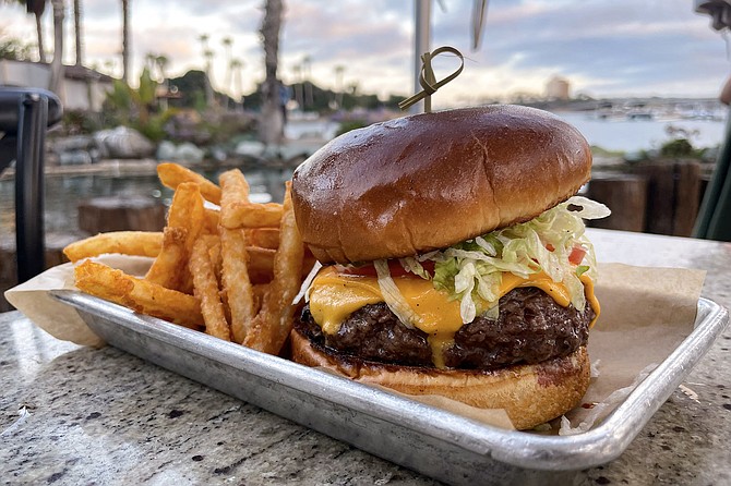A cheeseburger in Paradise Point, served by the Barefoot Bar & Grill, 60 years this summer.