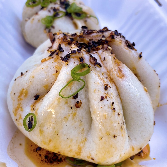 Aegan takes on a BBQ pork steamed bun (front) and pan-seared soup dumpling (back)