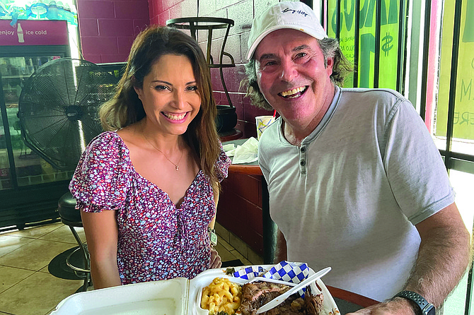 Maritza and Kevin work out plan of attack on his brisket dinner.