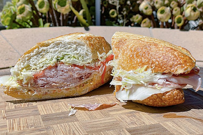 A muffuletta (ham, salami, and olive spread) on a house-baked roll