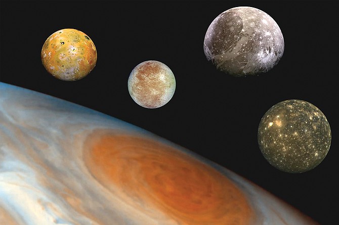This "family portrait," a composite of the Jovian system, includes the edge of Jupiter with its Great Red Spot, and Jupiter's four largest moons, known as the Galilean satellites.