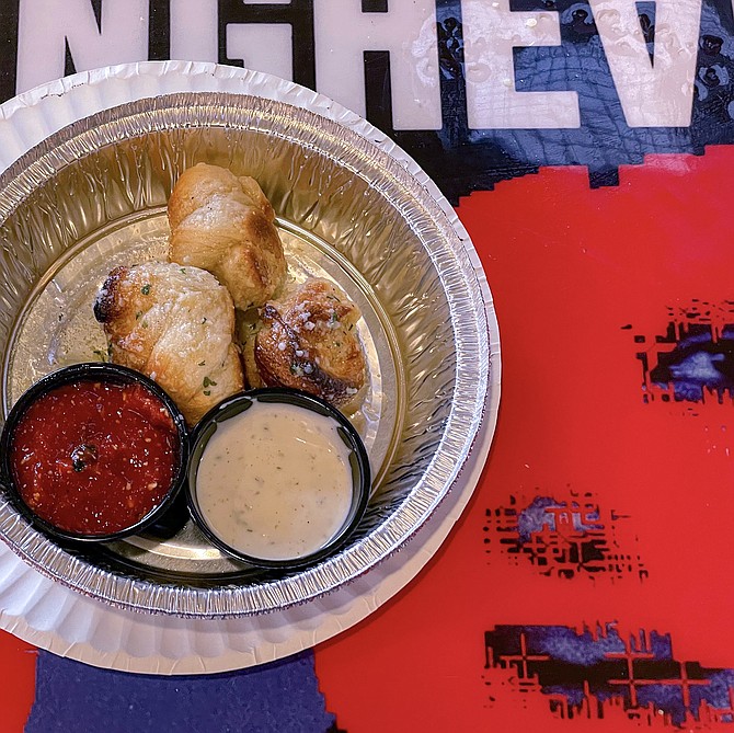 Buttery garlic knots, eaten over a Talking Heads album cover