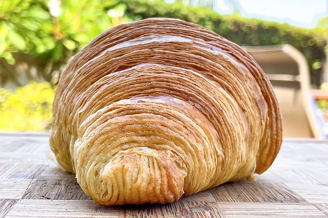 Refined layers of laminated dough are evident in this Homage Bakehouse croissant