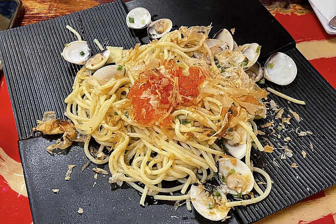 Clam spaghetti, made with Japanese ingredients including sake, miso, Kara, and bonito flakes