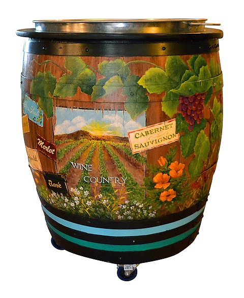 Local artists put their touch on wine barrels then they will be auctioned off live at the event.