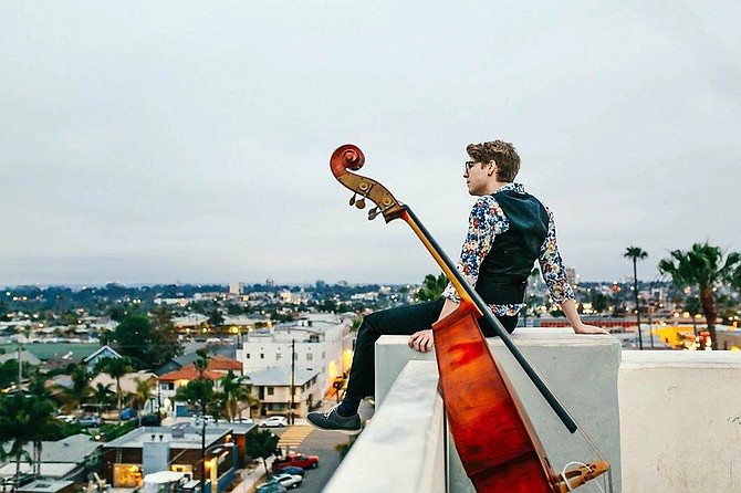 High-rise, low notes: Sean Hicke and his bass survey the local scene.