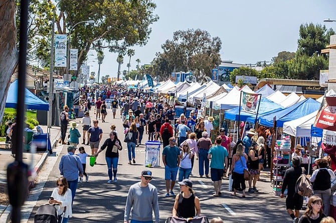 The Encinitas Spring Street Fair and Holiday Street Fair occupy six blocks of South Coast Highway 101, two blocks from the Pacific Ocean.