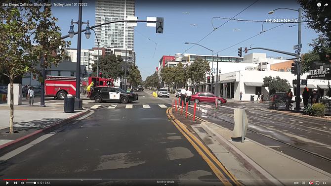 Next to trolley tracks on G Street and Park Boulevard a Mitsubishi collided with a Ford Explorer.