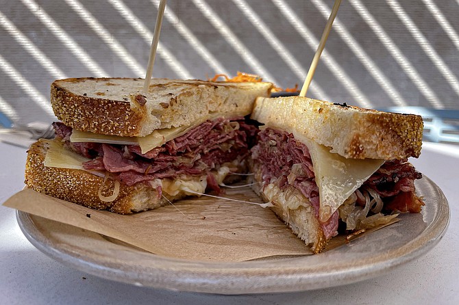 A "half and half" reuben, featuring both pastrami and corned beef