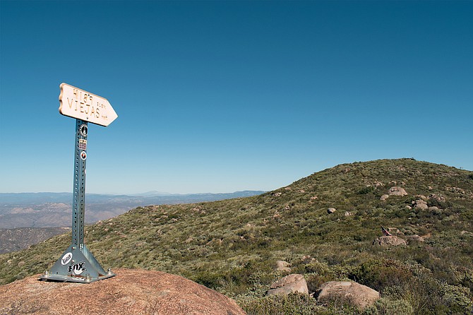 An Instaworthy metal post with a sign that reads 4189 Elev. Viejas Mtn.
