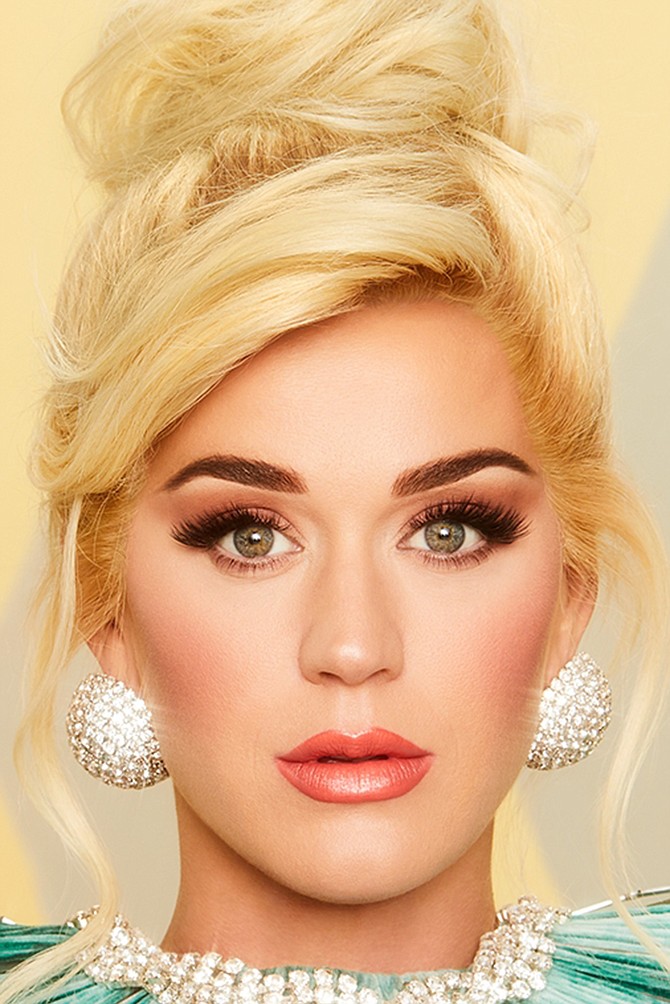 Katy Perry loves the sound of newsprint in the morning.