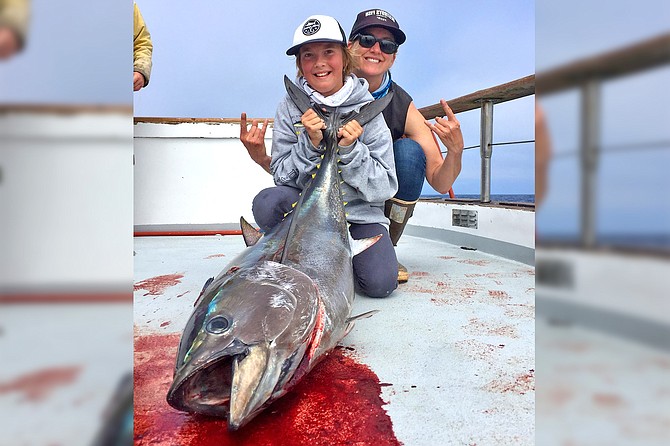 The fishing photo contest winner of two Half-Day passes is Oliver Peet from Ocean Beach! “Me and my mom go fishing a lot and this is the biggest fish I've ever caught. It's an 85 pound bluefin tuna it's about 4 feet long. I caught it on the Old Glory sportfishing boat out of H&M; Landing. It was caught on a flat fall jig, a custom rod, and a Daiwa reel. It was hard work landing the fish and the reel came off while I was reeling the fish in, my mom and the captain screwed it back in then we landed it.”