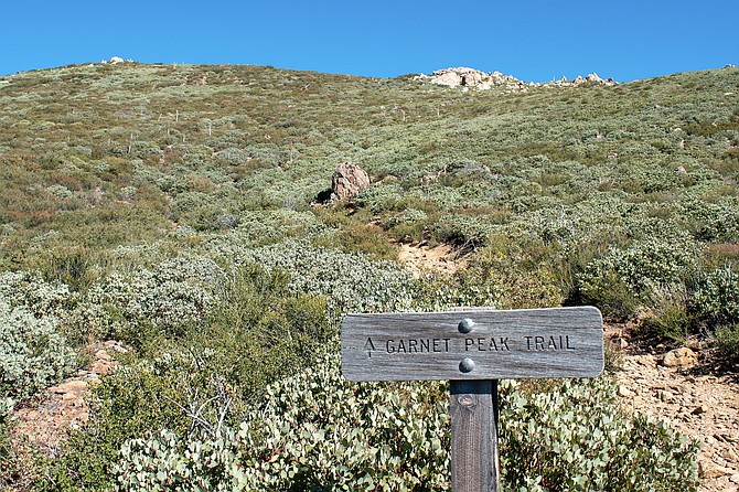 Garnet Peak sign marking the ascent.