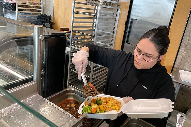 Server Andy fills my box of beef and broccoli, rice and veggies. At $8, a deal!