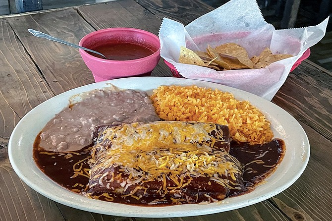 Shredded beef enchilada and pork tamale combo plate