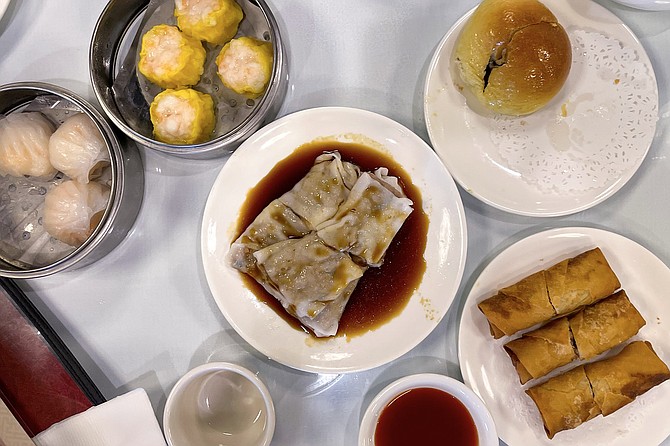 Small dishes begin to fill the table at a new dim sum restaurant
