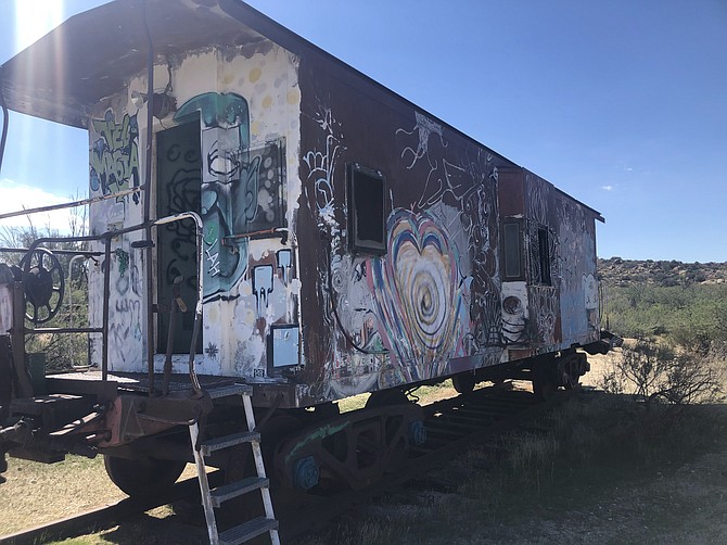 Kirk explains that the colorful graffitied train car sitting on their property was the inspiration and cover art for a recent Stephen King novel.