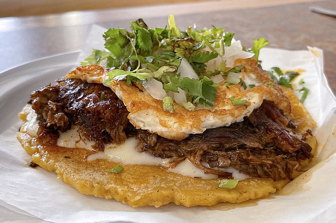 El Comandante, a quesabirria taco made with birria tatemado and topped with a fried egg