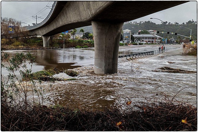 San Diego River flows over Mission Center Drive