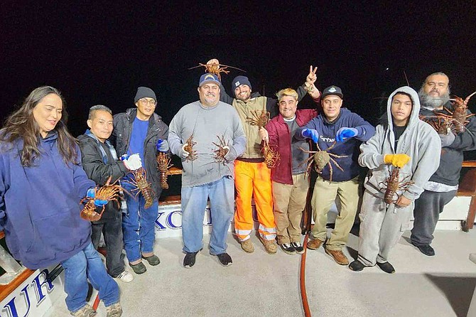 Happy hoopsters with some tasty bugs aboard the Jig Strike