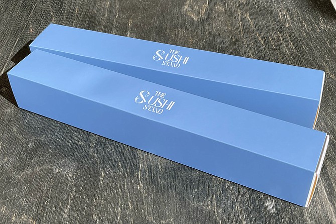 Sleek, blue boxes made for sushi rolls