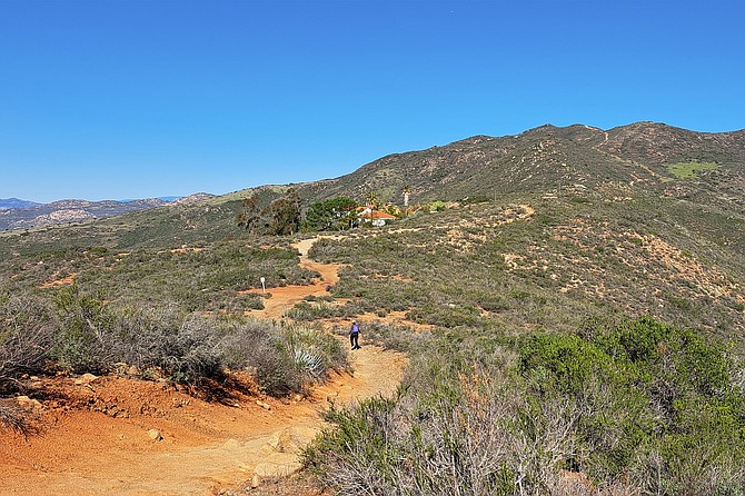 Flat broad ridge that winds behind mansions.
