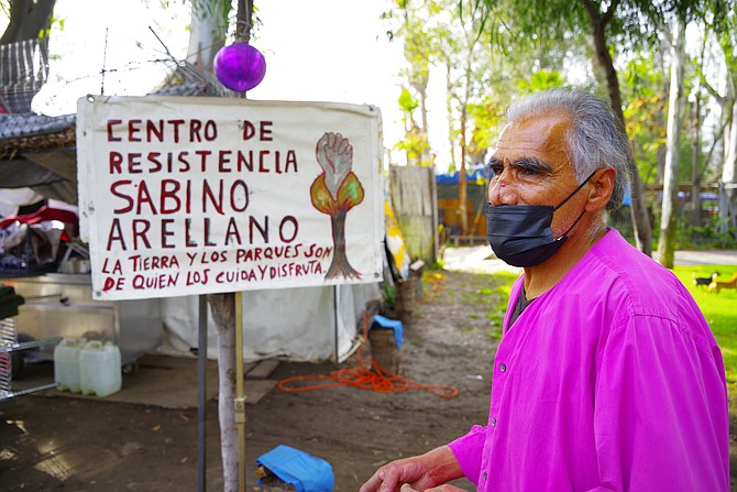 Felipe Gomez has been taking care of the park. (Bottom of sign: "The land and the parks belong to those who care for and enjoy them.") - Image by Crisstian Villicana