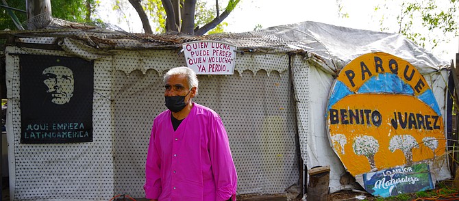 Sign on left: "Latin America starts here"
Sign in middle: "Whoever fights can lose; whoever doesn't fight has already lost"