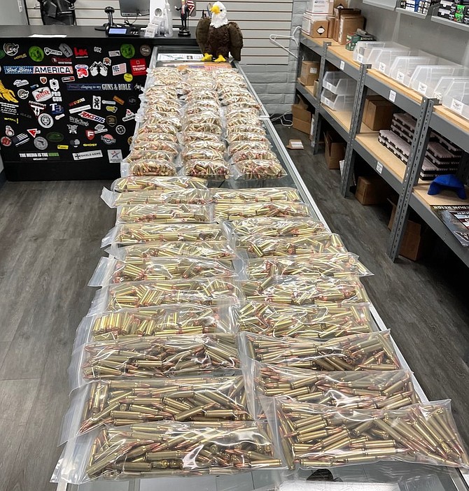 The alleged burglar used that time to load twelve different weapons with ammunition.