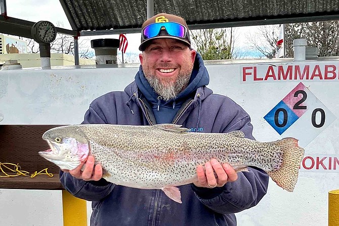 “This 9.75-pound rainbow was caught this morning at Lone Pine using a garlic night crawler, making for one happy angler!”
