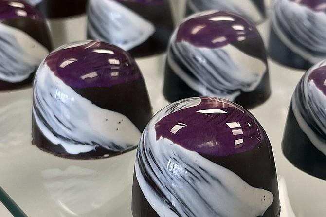 Raspberry ganache, with colored cocoa butter brush strokes