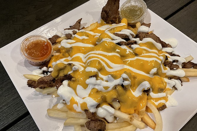 Arty presentation of fries dish.