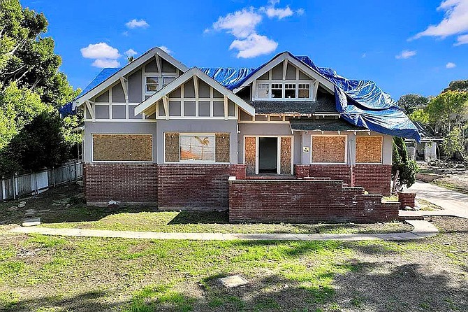 Craftsman-style architecture with Tudor Revival influences...and copious water damage.