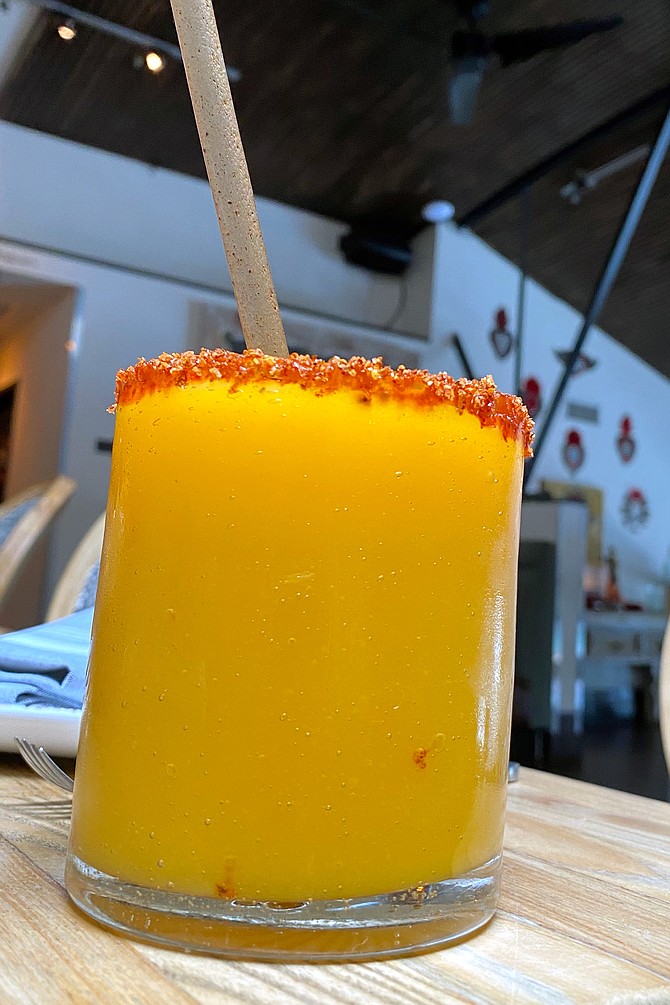 A slushy mango margarita to cool the salsa’s heat.