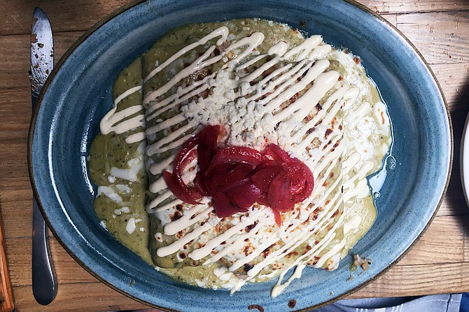 The lively tang on the Enchiladas Marisco Suiza came partly from the pink pickled onions, partly from the tomatillo-jalapeno crema.