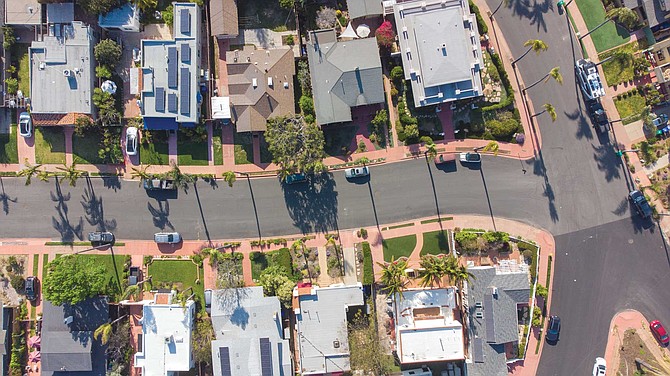 The Burlingame community of San Diego, built in 1912, is sandwiched between North Park to the north and east and by South Park to the south. After the streets were graded by mule teams and paved with crushed granite, it was decided to add a dull red tint to the concrete for the sidewalks to give them a unique look.