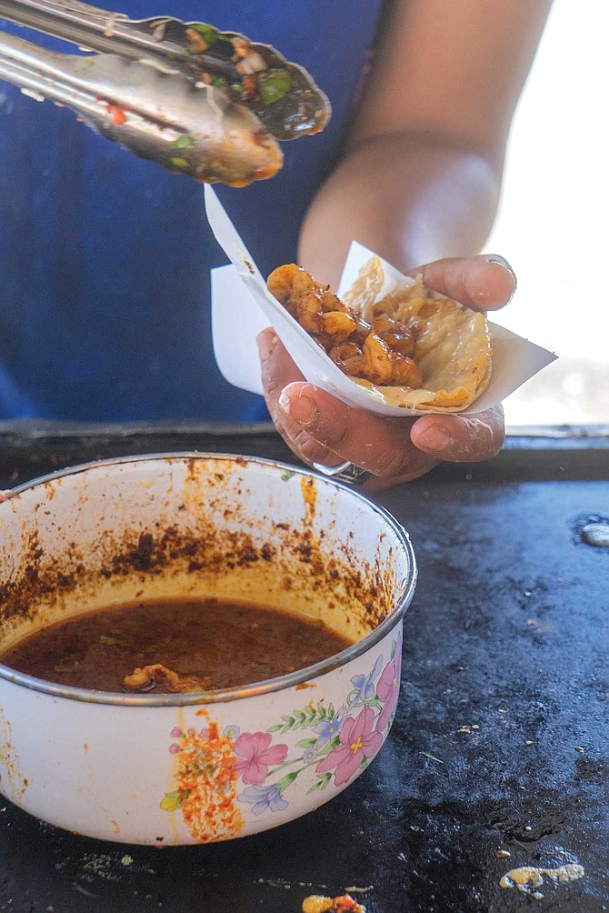 I could write a love song about this taco at Los Compadres. It’s gigantic, greasy, has lots of melted cheese that gets burnt around the crust of the tortilla, and is loaded with a lot of flash-fried shrimp that has been dunked in buttery chili sauce.