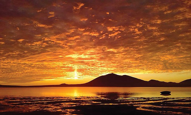 Volcanos and sunsets can make for an awesome view.