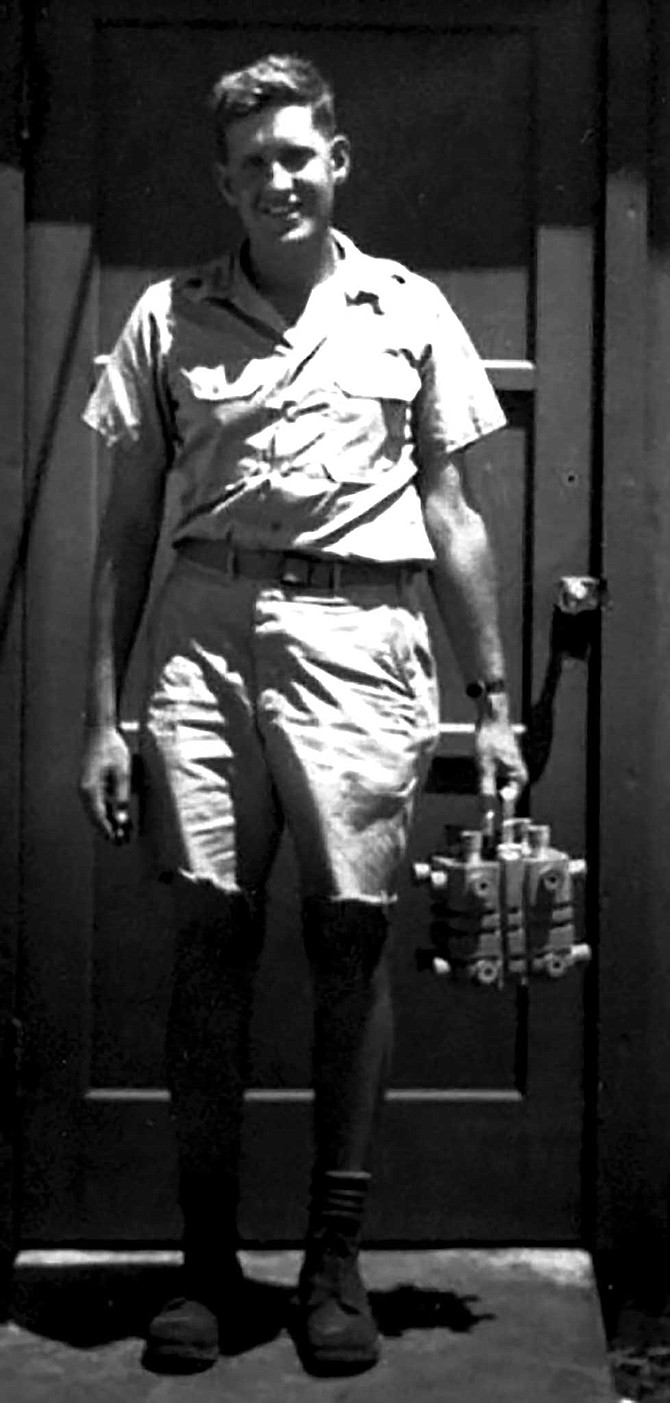 Harold Agnew in 1945, carrying the plutonium core of the Nagasaki Fat Man bomb