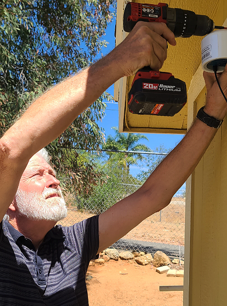 Sedio installing PurpleAir sensor