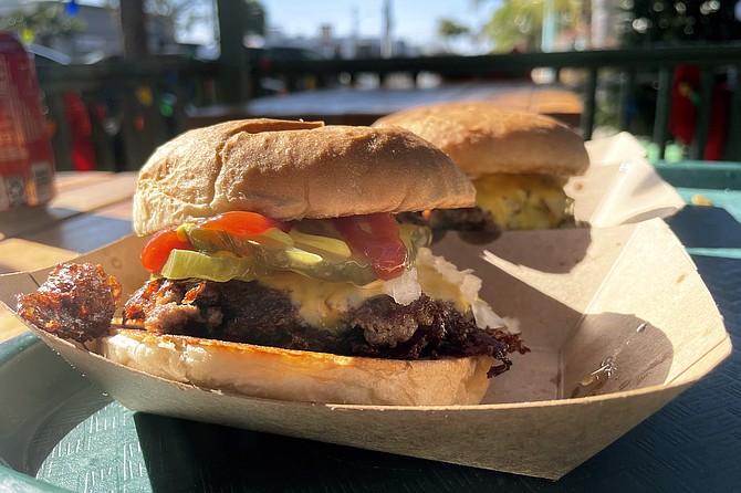 The All-American burger: an OG dirty flat top, except with pickles, mustard, and ketchup