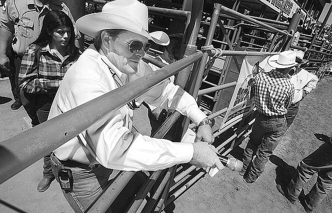 The Reverend Bob Harris at Lakeside Rodeo: "My goal is to be an example of the rodeo cowboy who can live the Christian life." - Image by Sandy Huffaker, Jr.