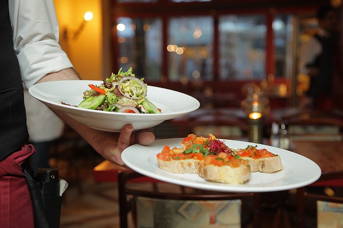 Serving food at restaurant