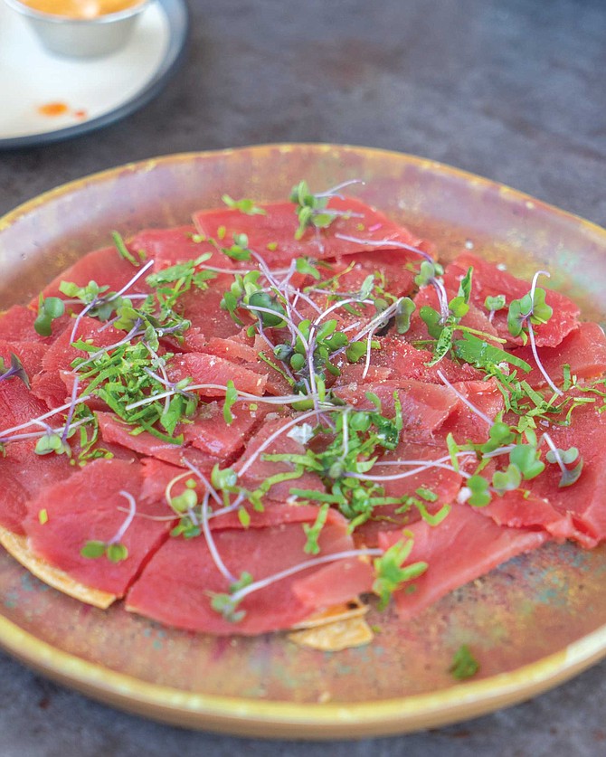 MOMO’s surprise gratis serving of fresh tuna on top of a big tostada cut in the shape of a pizza with ponzu mayo, red onion, truffle oil, and microgreens. The oil enhanced the tuna flavor, leaving a pleasant lingering taste over the whole palate.