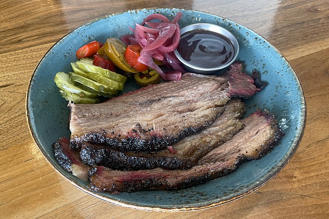 Succulent and savory smoked brisket served at Heritage Barbecue @ Beer Co.